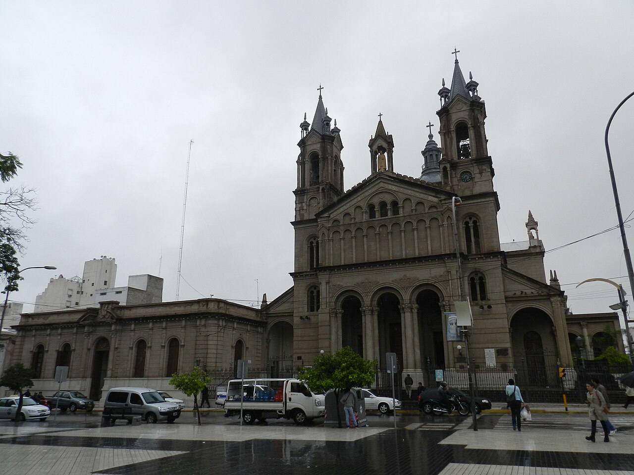 Twin-towered facade of San Nicolás de Bari Cathedral in La Rioja, seen across a public street.