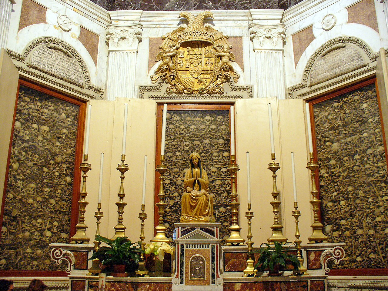 Glass-fronted cabinets containing remains in the Martyrs’ Chapel of Otranto Cathedral.