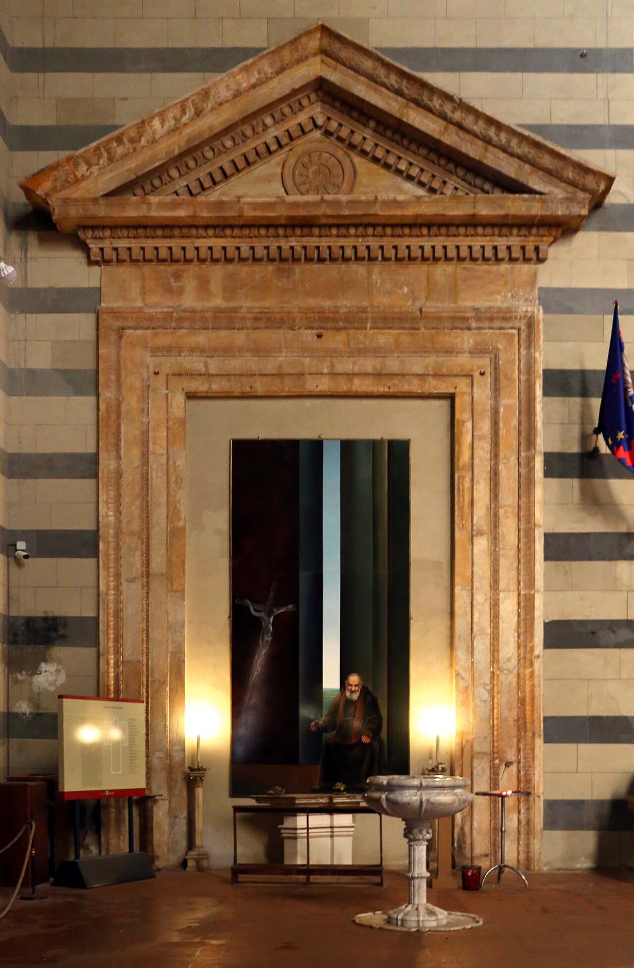 The historic side portal by Francesco di Giorgio Martini inside San Francesco, Siena